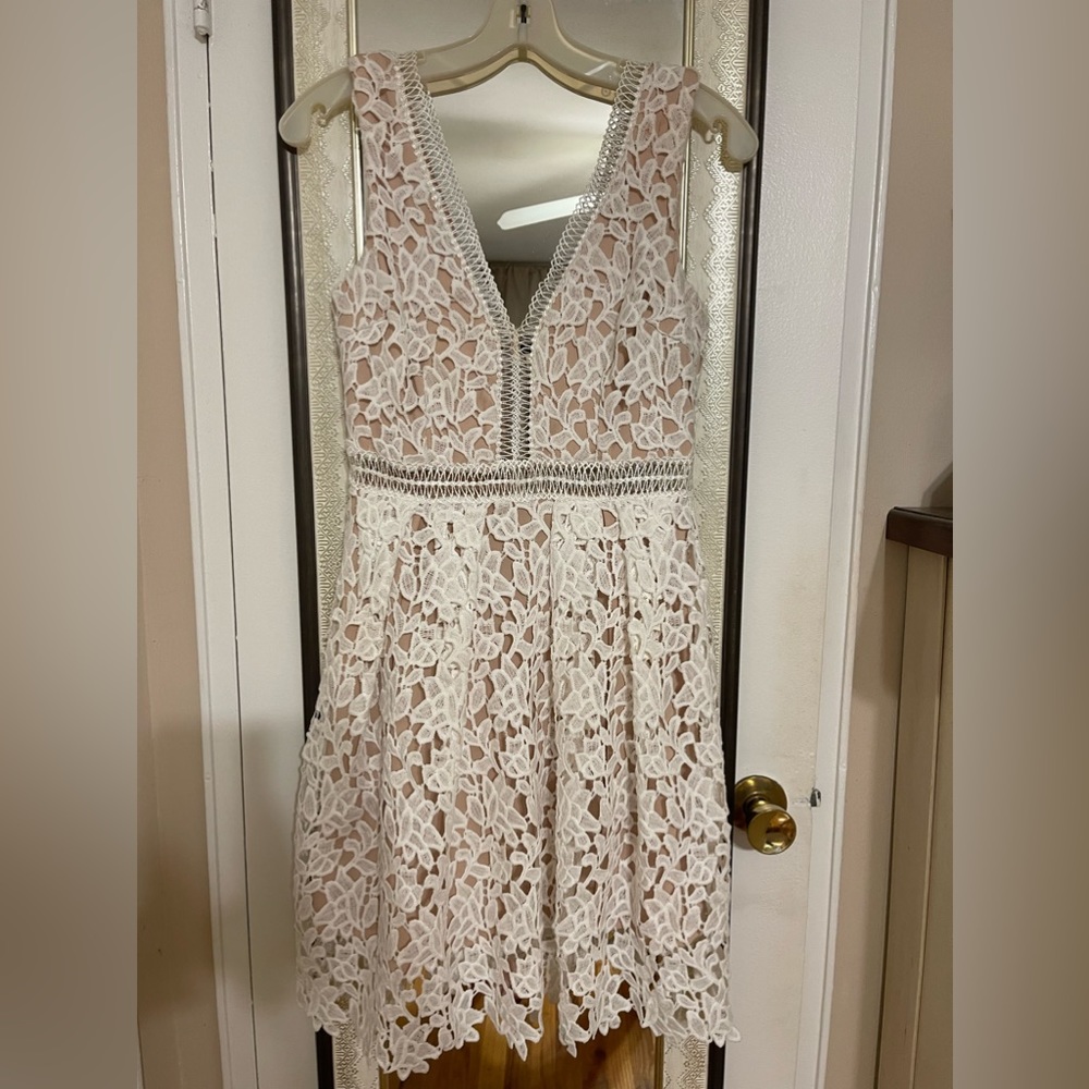 Beautiful pre loved white lace with nude slip underneath.